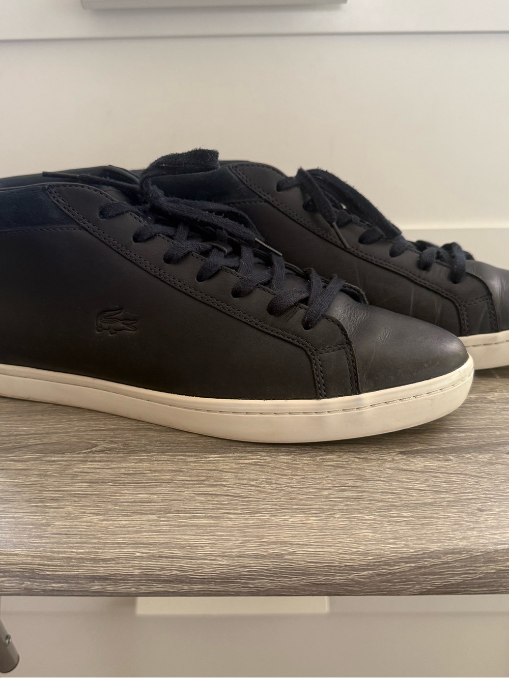 Lacoste Black Leather Low-Top Sneakers with White Sole.